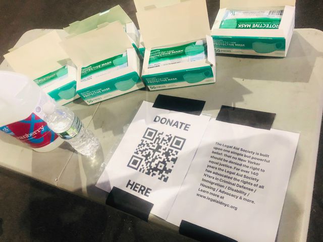 A photo of the mask and donation set up at the bridge rave